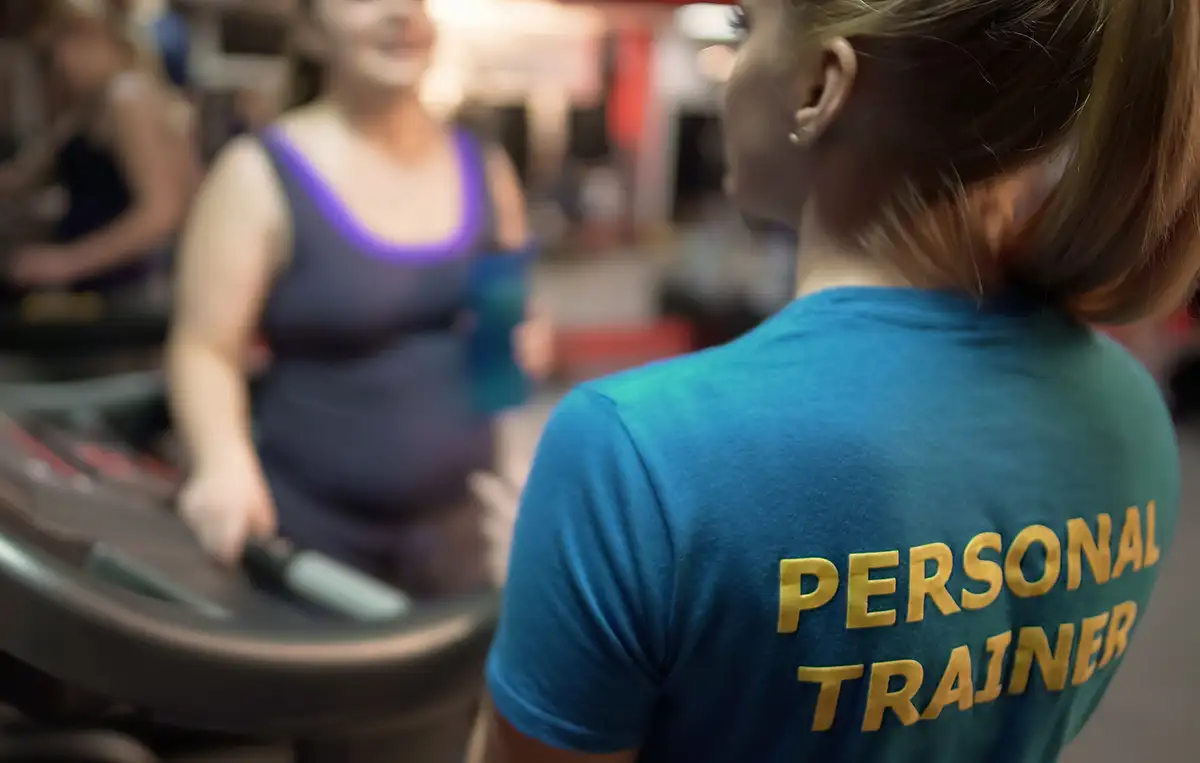 female personal trainer working with clients at the gym - Collinsville, IL - Bethalto, IL