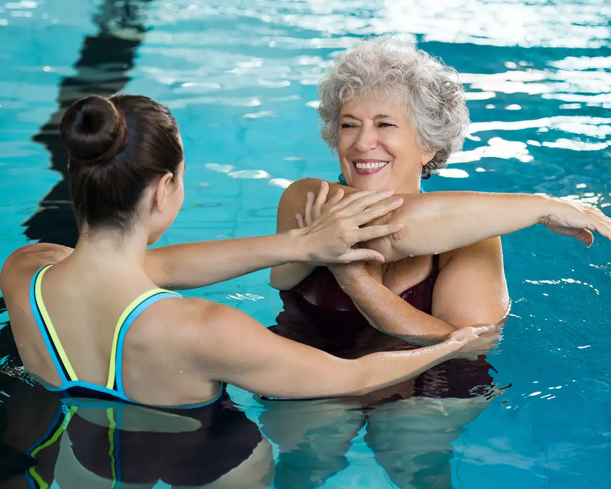 Senior woman in a water aerobics class for her arthritis - Collinsville, IL - Bethalto, IL